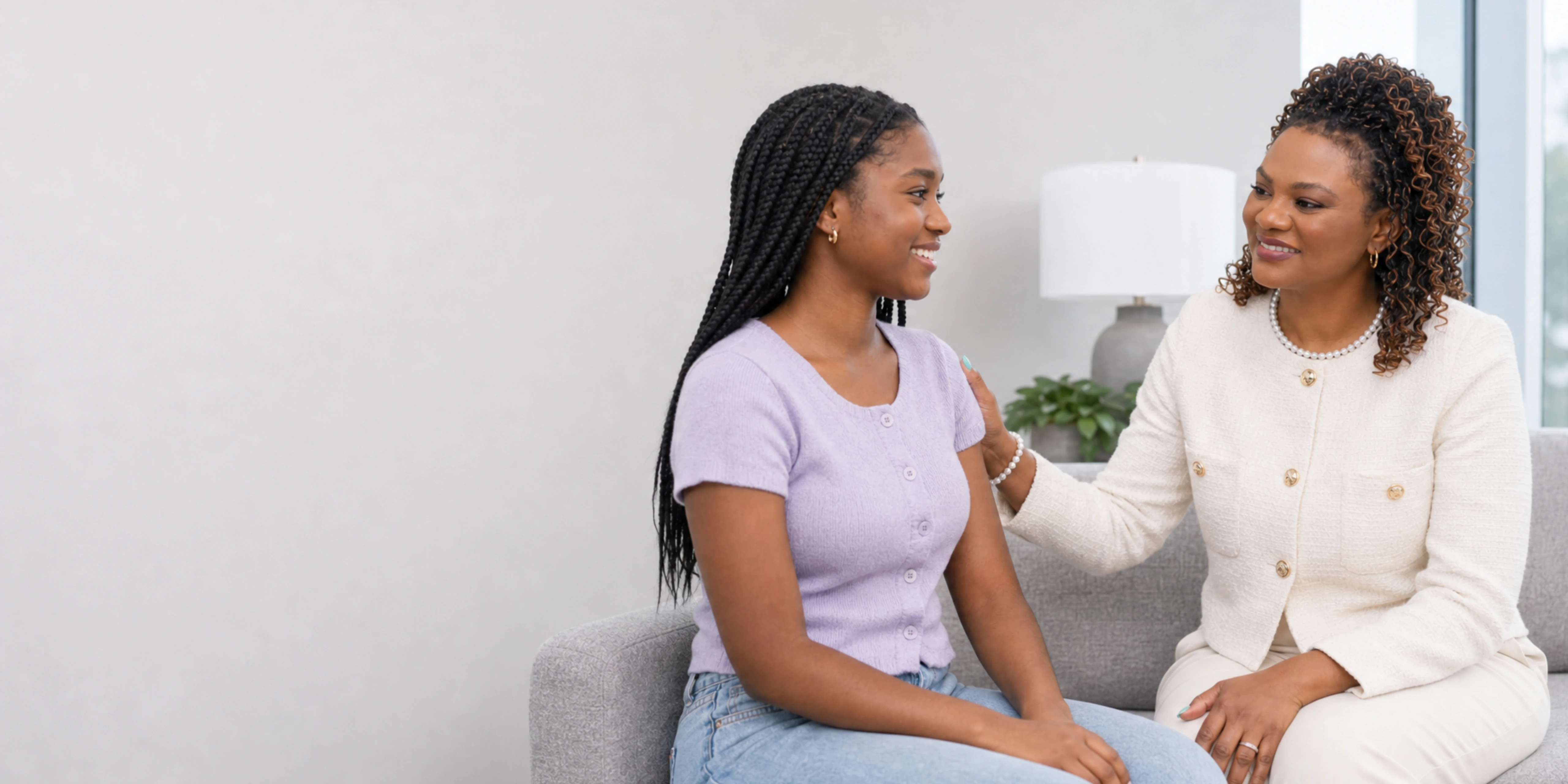An adult patient speaking privately with Dr. Perpetua Ezeh-Aideyan